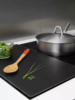 Planche de protection pour plaque de cuisson